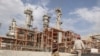 Iran -- Iranian workers walk at a unit of South Pars Gas field in Asalouyeh Seaport, north of Persian Gulf, November 19, 2015