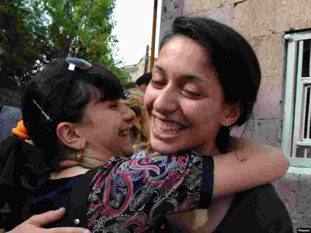 Armenian journalist Ani Gevorgian (right), arrested while covering an opposition protest, celebrates her release after three days in detention. Photo by Photolur 