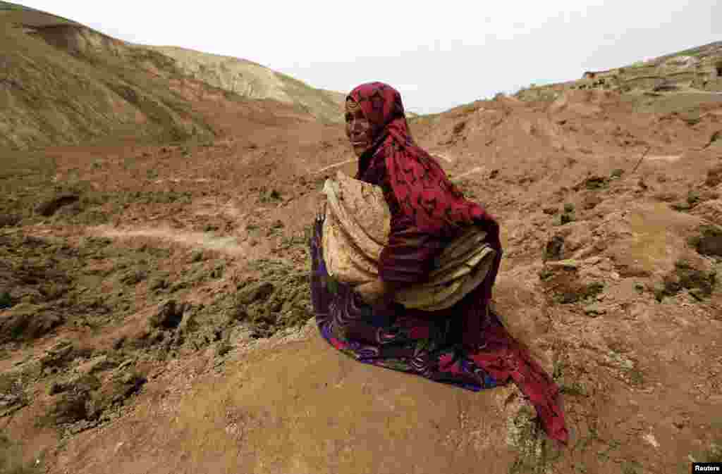 An Afghan woman cries after she lost her family in a landslide in the Argo district in Badakhshan Province. (Reuters/Mohammad Ismail)