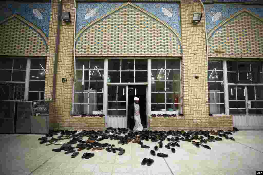 An Iraqi Shi&#39;ite scholar stands outside a classroom at a school for clerics in the holy city of Najaf. (AFP/Haidar Hamdani)