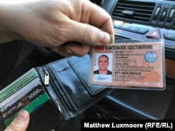 Konstantin Vyatkin shows off his new "Soviet" driver's license.
