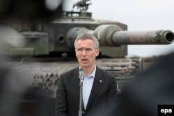 NATO Secretary-General Jens Stoltenberg speaks at a press conference during the NATO Noble Jump 2015 exercises at the 10th Armored Cavalry Brigade military range in Swietoszow, Poland, on June 18.