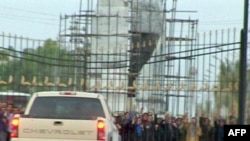 Members of the Iranian opposition-in-exile protest in Camp Ashraf on July 28.