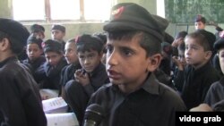 FILE: Students in a crowded school in Mingora, Swat.