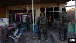 Афганские военнослужащие на территории военной базы в Кандагаре, где происходили столкновения с талибами. 9 декабря 2015 года.