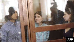 Members of Pussy Riot during a court hearing in Moscow on July 30: Nadezhda Tolokonnikova (left), Yekaterina Samutsevich (center), and Maria Alyokhina. They face up to seven years in prison.