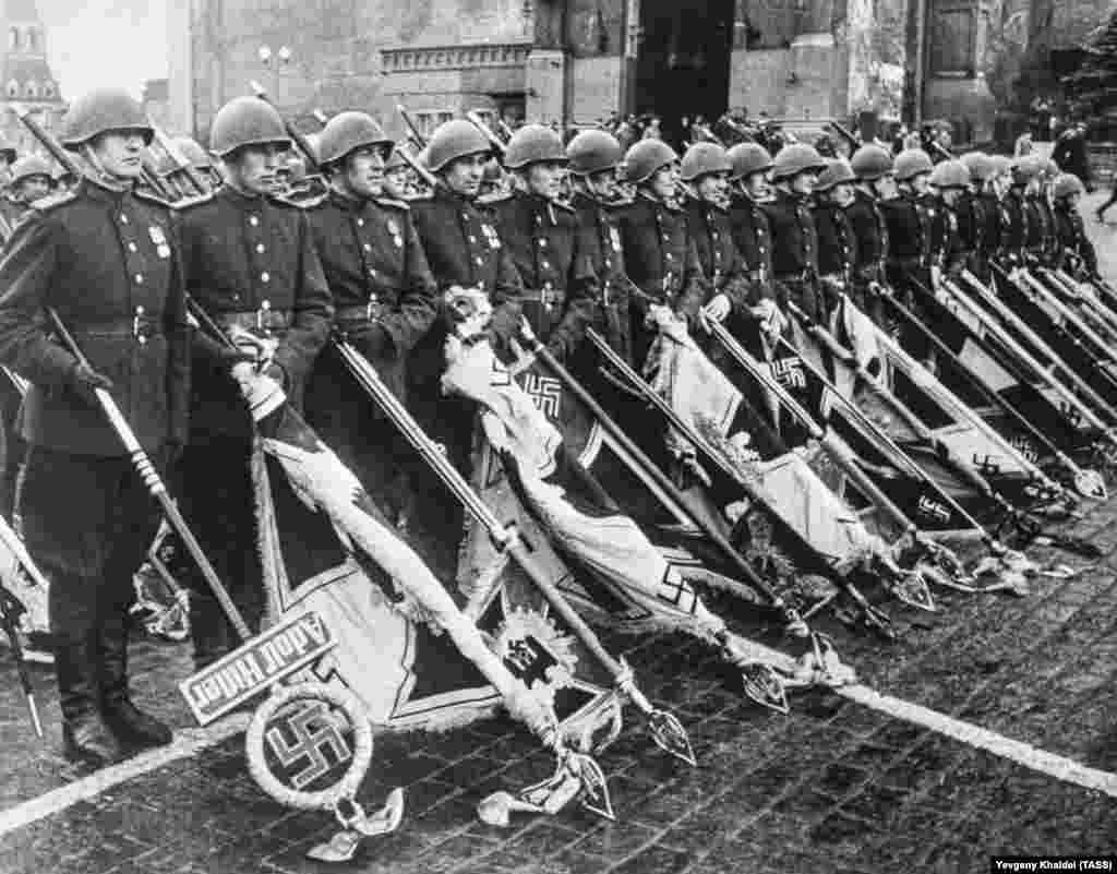 Nazi banners during a victory march on Red Square in Moscow. The banners were paraded across the square before being tossed in a heap beneath Josef Stalin. Soon after the Allies' victory over Nazi Germany, however, the paranoid Soviet dictator would unleash his own strain of anti-Semitism on the Soviet population.