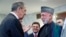 Russian Foreign Minister Sergei Lavrov (left) and former Afghan President Hamid Karzai talk at a meeting dedicated to the 100th anniversary of official Russian-Afghan diplomatic relations in Moscow on May 28.