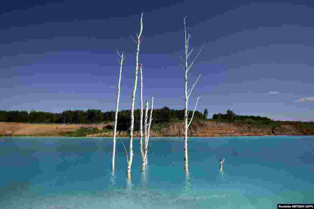 A view of a Novosibirsk energy plant&#39;s ash dump site -- nicknamed the &quot;Maldives.&quot; The Siberian site, whose turquoise lake resembles a tropical paradise, has become a magnet for Instagrammers who risk their health in the toxic water to wow online followers. (AFP/Rostislav Netisov)