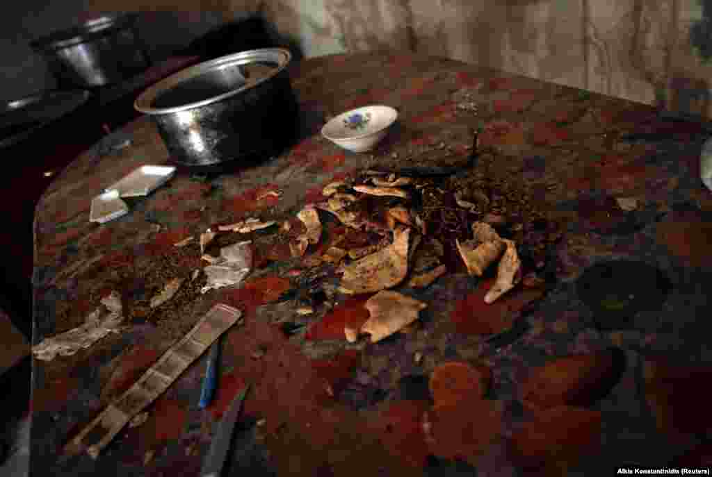 Discarded flatbread on a kitchen table inside the prison. Islamic State is reportedly instructing followers to eat the flesh of non-Muslims in times of need during war. 