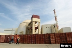 A Russian worker walks past the Bushehr nuclear power plant, located 1,200 kilometers south of Tehran (file photo)