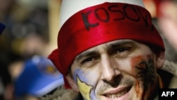 A Kosovar man celebrates on the first anniversary of Kosovo's independence declaration on February 17 of this year.