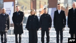 (Left to right:) European Council President Antonio Costa, LatvianPresident Edgars Rinkevics, Ukrainian first lady Olena Zelenska, Ukrainian President Volodymyr Zelensky, Finnish President Alexander Stubb, and Lithuanian President Gitanas Nauseda stand in respect during a ceremony to mark the third anniversary of Russia's full-scale invasion of Ukraine on Kyiv's Independence Square on February 25.