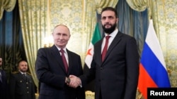  Руският президент Владимир Путин и сирийският водач Ахмед ал-Шараа в Москва, 15 октомври, 2025 година 