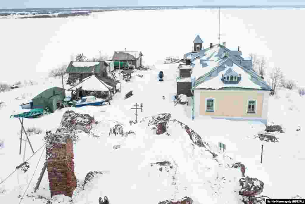 The view of Kammeny Island from the bell tower shows the ruins of the historic monastery cathedral destroyed by the Soviets.