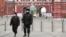 Russian police officers patrol a deserted Red Square in Moscow, which went into lockdown on March 30. 