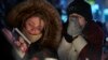 Mourners in Ontario, Canada, weep during a vigil for the victims of Ukrainian Airlines Flight PS752, which was shot down by Iran in 2020, killing all 176 people on board. 