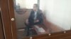 Nurbek Qushaqbaev in an Astana courtroom on April 3