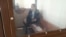 Nurbek Qushaqbaev in an Astana courtroom on April 3