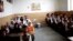 Afghan schoolchildren attend a class at the Shahid Nasseri refugee camp in the village of Taraz Nahid near the city of Saveh, some 130 kilometers southwest of the Iranian capital, Tehran, in February 2015.
