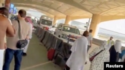 Ambulances line up outside of Riyadh's airport after a suspected Houthi air strike on October 10.