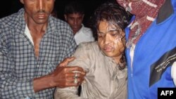 A Bangladeshi woman is rescued from the capsized ferry in the remote coastal village of Bhola.