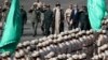 Supreme Leader Ayatollah Ali Khamenei walks alongside military officials, during a gradation ceremony at Tehran's police academy on September 17.