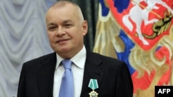 TV anchor and news agency Rossiya Segodnya boss Dmitry Kiselyov (seen receiving a state award) said "we know the names" of those within the "fifth column."