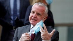 U.S. Ambassador to Russia John Sullivan talks to reporters outside the court in Moscow on June 15.