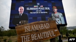 An electronic board featuring Pakistani Prime Minister Shehbaz Sharif (left) and Field Marshal Syed Asim Munir is displayed during earlier talks in Islamabad.