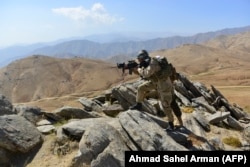 Afghan resistance movement and anti-Taliban uprising forces patrol on a hilltop in the Darband area of the Anaba district, Panjshir Province, in September.