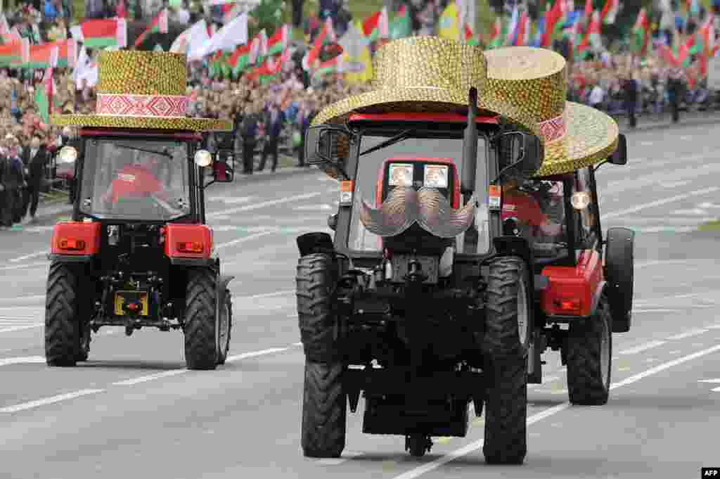 Belarusian tractors take part in a parade during events marking Independence Day on July 3 in Minsk. (AFP/Sergei Gapon)