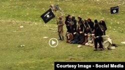 FILE: Grab from a video that shows militants loyal to the Islamic State (IS) blowing up bound and blindfolded Afghan prisoners with explosives. The victims were from Nangarhar Province. IS released the video in August 2015.