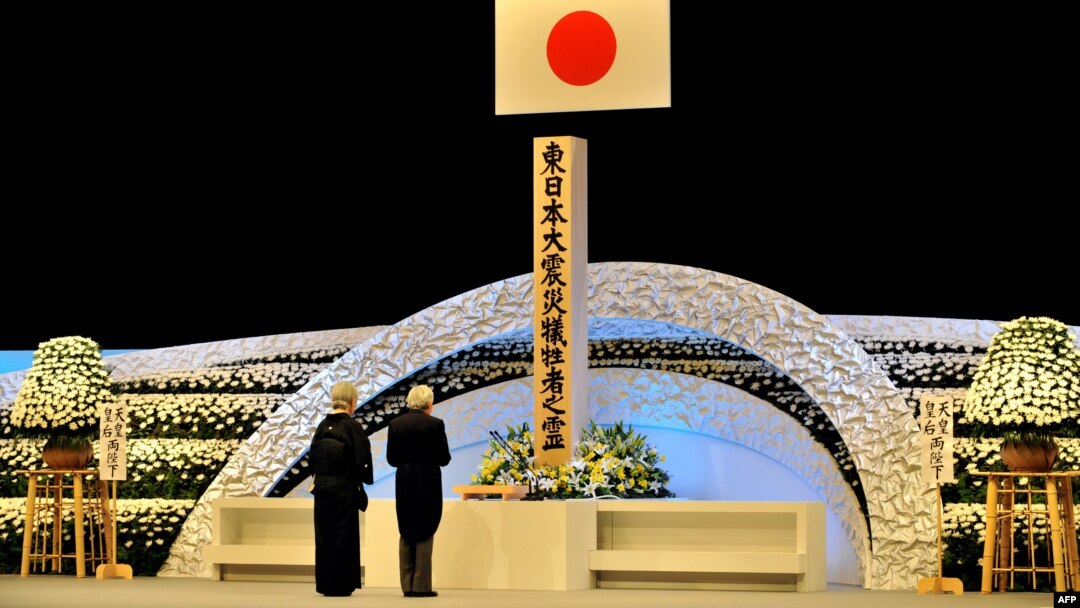 Japanese Emperor Akihito (right) and Empress Michiko pay their respects before an altar in Tokyo during a memorial service for the victims of the March 11, 2011, earthquake and tsunami. 