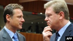 EU Enlargement Commissioner Stefan Fuele (right) speaks with Croatian Foreign Minister Gordan Jandrokovic before the seventh meeting of the EU-Croatia Stabilization and Association Council in Brussels on April 19.