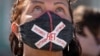 A woman wears a face mask with the message "No To Putin" during a protest against the constitutional amendments in St. Petersburg on July 1.