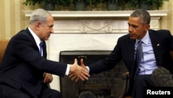 U.S. President Barack Obama and Israeli Prime Minister Benjamin Netanyahu shake hands during their meeting in the White House.