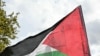 A protester waves a Palestinian flag during a march asking for the "recognition of the State of Palestine and the end of the genocide", in Paris on September 21, 2025.