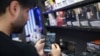 An Iranian man in Tehran uses his phone after the reported reopening of international internet access on May 27. 