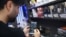 An Iranian man in Tehran uses his phone after the reported reopening of international internet access on May 27. 