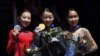 US - Rika Kihira of Japan (C) celebrates after winning the Womens competition with second place Elizabet Tursynbaeva of Kazakhstan (L) and third place Mai Mihara of Japan (R) during the ISU Four Continents Figure Skating Championship at the Honda Center i