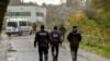 Policemen spread around the "Centre Zahra France" religious association in Grande Synthe during an operation of "terrorism prevention", near Dunkirk, October 2, 2018