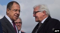 Russian Foreign Minister Sergei Lavrov (L) greets his German counterpart Frank-Walter Steinmeier just outside Volgograd on May 7. 