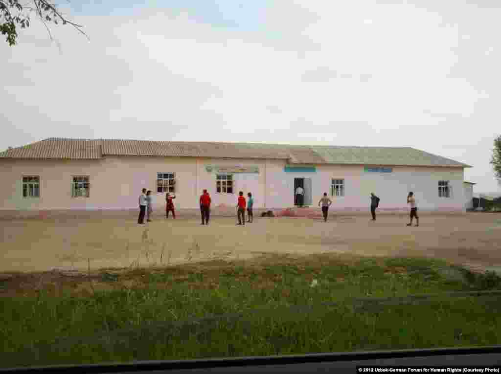 Students, ages 16 to 18, from the Transportation College of Tashkent sent to pick cotton in the Komil district of Jizzakh Province play volleyball in front of the barracks where they will stay until their quota is fully harvested. Refusing participation is not an option; students are threatened with expulsion from school.