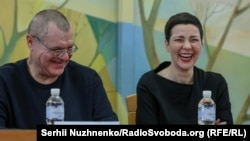 Maryya Kalesnikava (right) and Viktar Babaryka, two of the political prisoners released from Belarus, speak at a press conference on December 14.