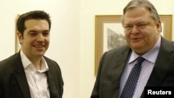 Leader of Greece's leftist Syriza bloc Alexis Tsipras (left) with the leader of the Socialist PASOK party Evangelos Venizelos after a meeting in Athens earlier this month. 