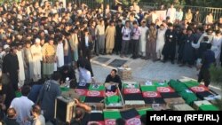 Coffins of those killed in a bomb attack on a Shi'ite mosque in Herat.