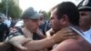 Armenia - A youth activist clashes with a policeman during a demonstration against an electricity price rise, Yerevan, 1Aug2015.