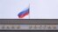 A Russian flag flies over the headquarters of the country's central bank in Moscow (file photo)