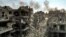 TOPSHOT - This picture taken on October 11, 2023 shows an aerial view of buildings destroyed by Israeli air strikes in the Jabalia camp for Palestinian refugees in Gaza City.